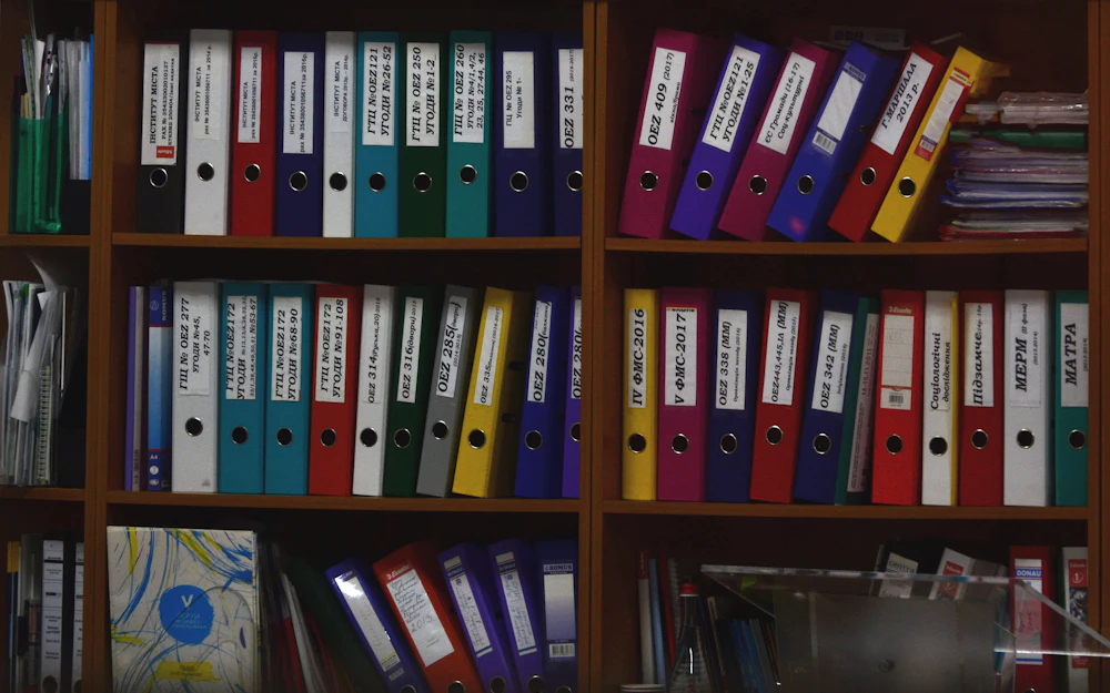 Rows of binders on office shelves